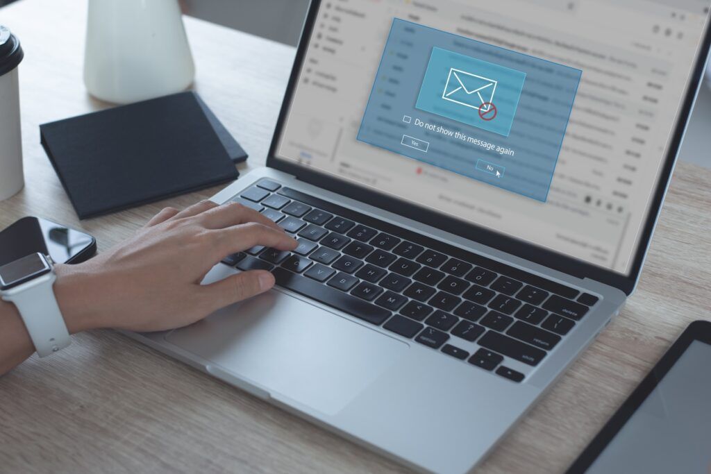 person using computer email, email scams