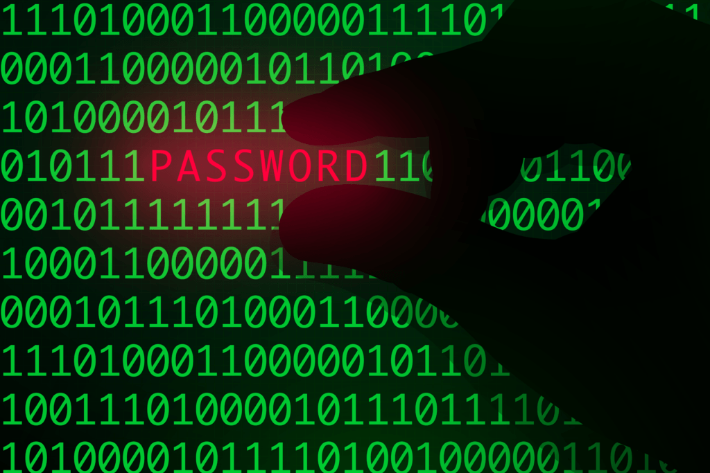 A silhouette of a hand pulled a password out of binary strings to depict password cracking