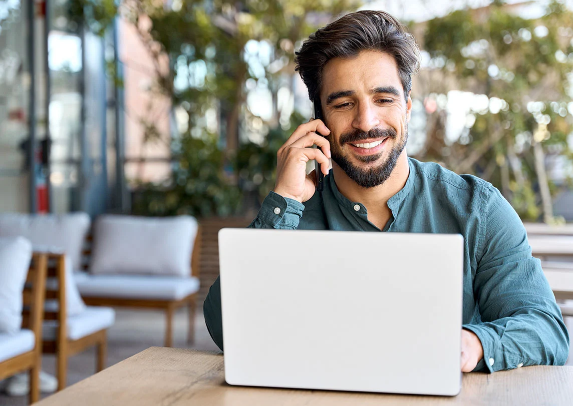 Man using laptop outside